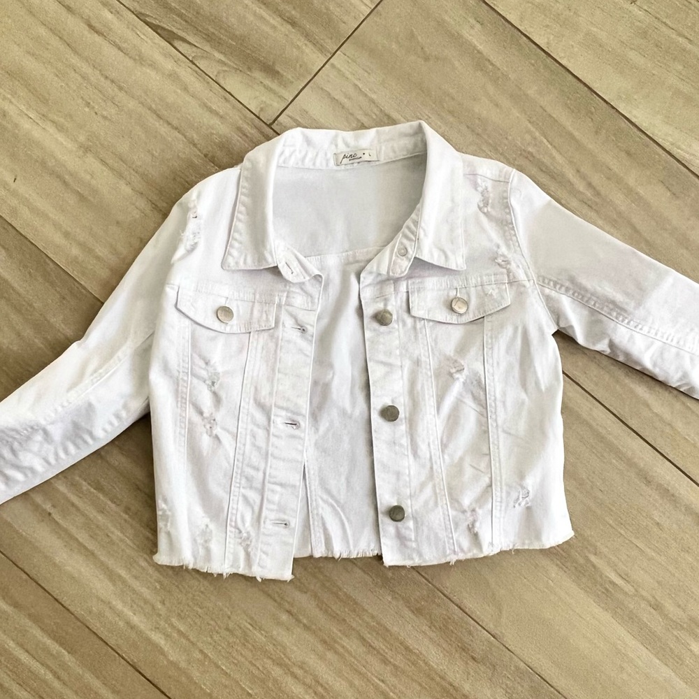 Girls PINC white denim jacket.